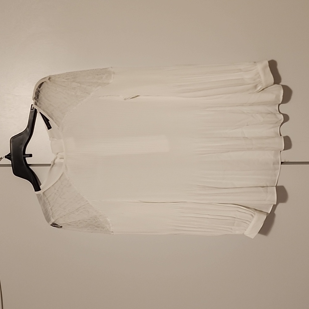 Womens white blouse with lace and accent on a back